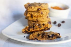 paleo pumpkin chocolate chip cookies stacked and center shown