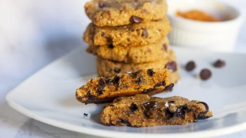 paleo pumpkin chocolate chip cookies stacked and center shown