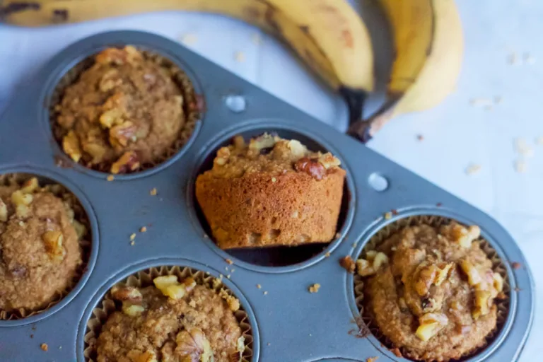 fluffy banana nut muffins in a muffin pan