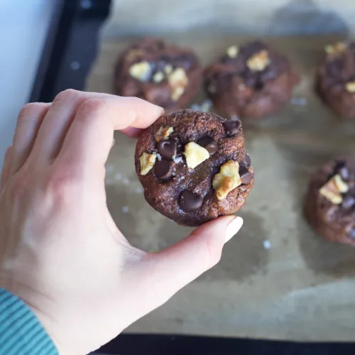 a choclate cookie with walnuts and chocolate chips