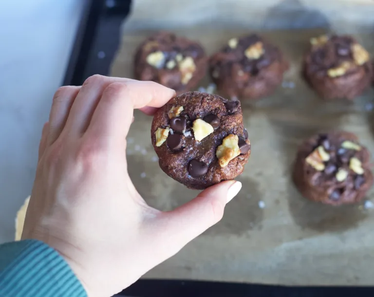 a choclate cookie with walnuts and chocolate chips