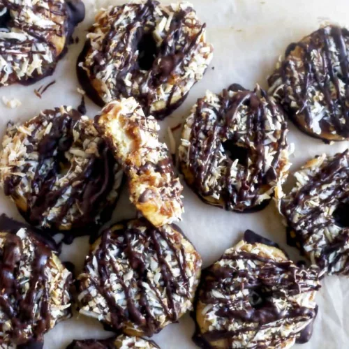 chocolate coocnut caramel cookies on parchment paper
