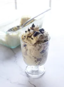 ice cream in a cup with chocoalte chunks on top!