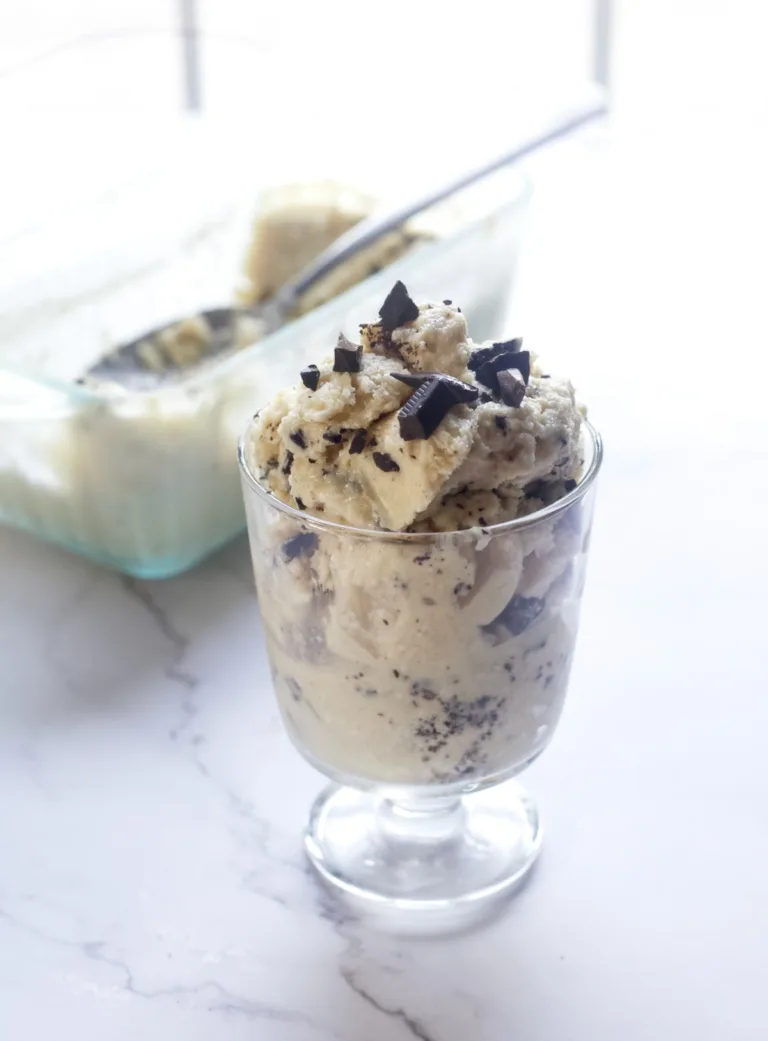 ice cream in a cup with chocoalte chunks on top!