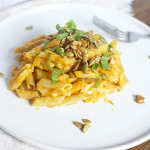 pumpkin pasta on a plate with a fork