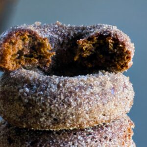 paleo apple cider donuts with bite out of it